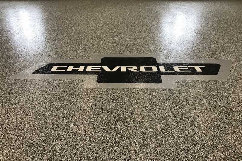 Decorative garage floor with logo.